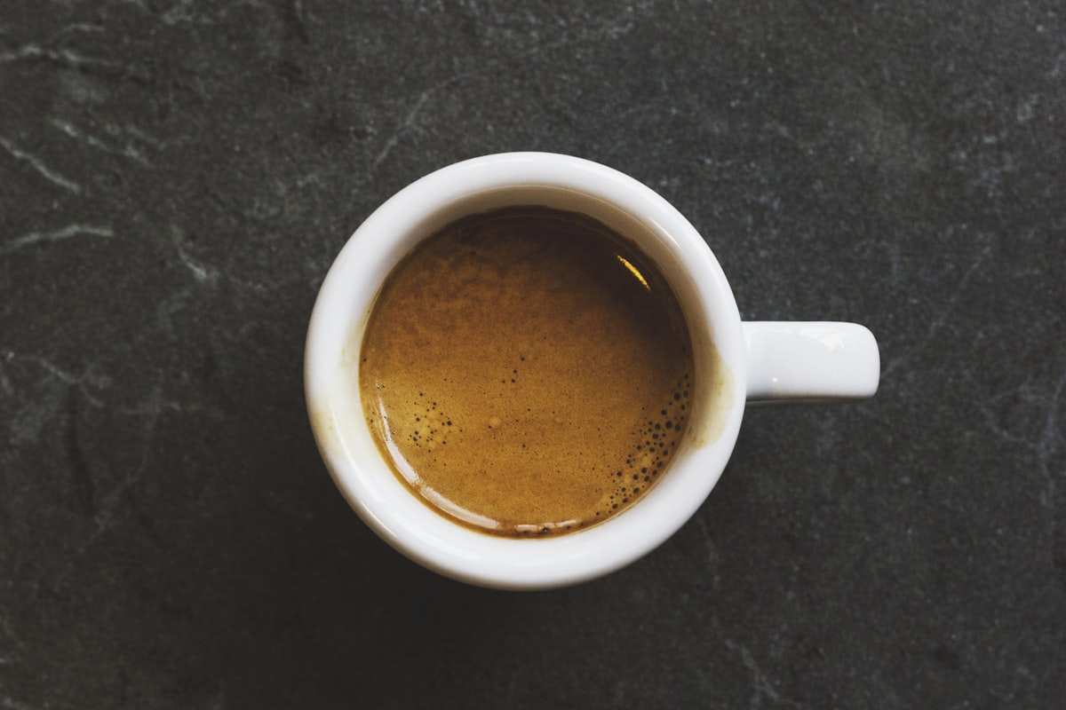 Specialty coffee pour-over with vibrant steam rising — bright acidity and clean flavor profile by Grenade Coffee