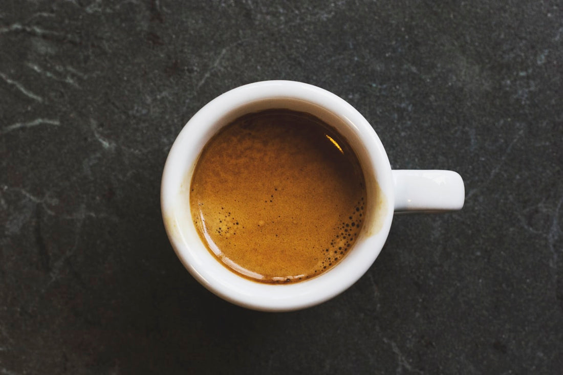 Specialty coffee pour-over with vibrant steam rising — bright acidity and clean flavor profile by Grenade Coffee