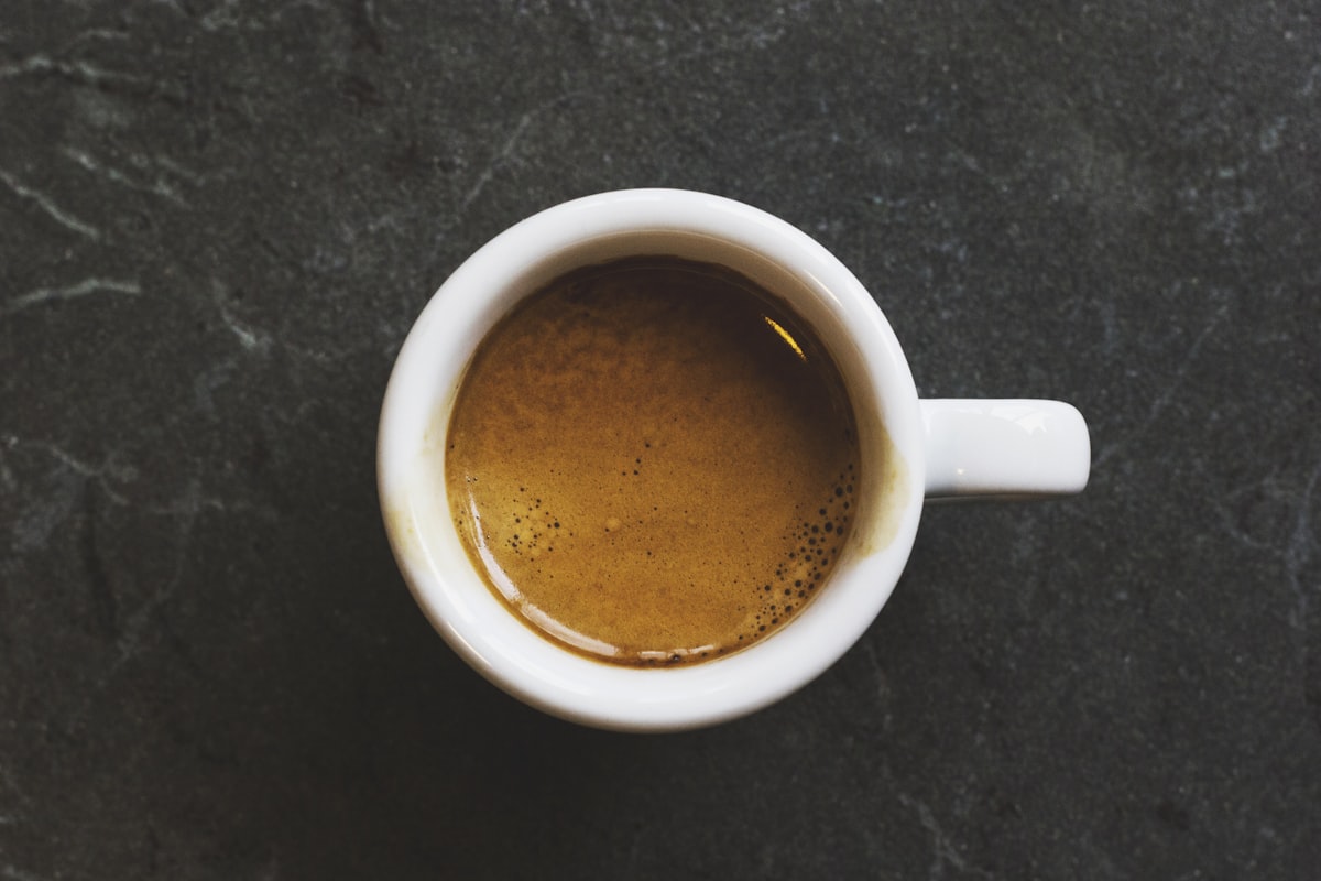 Specialty coffee pour-over with vibrant steam rising — bright acidity and clean flavor profile by Grenade Coffee