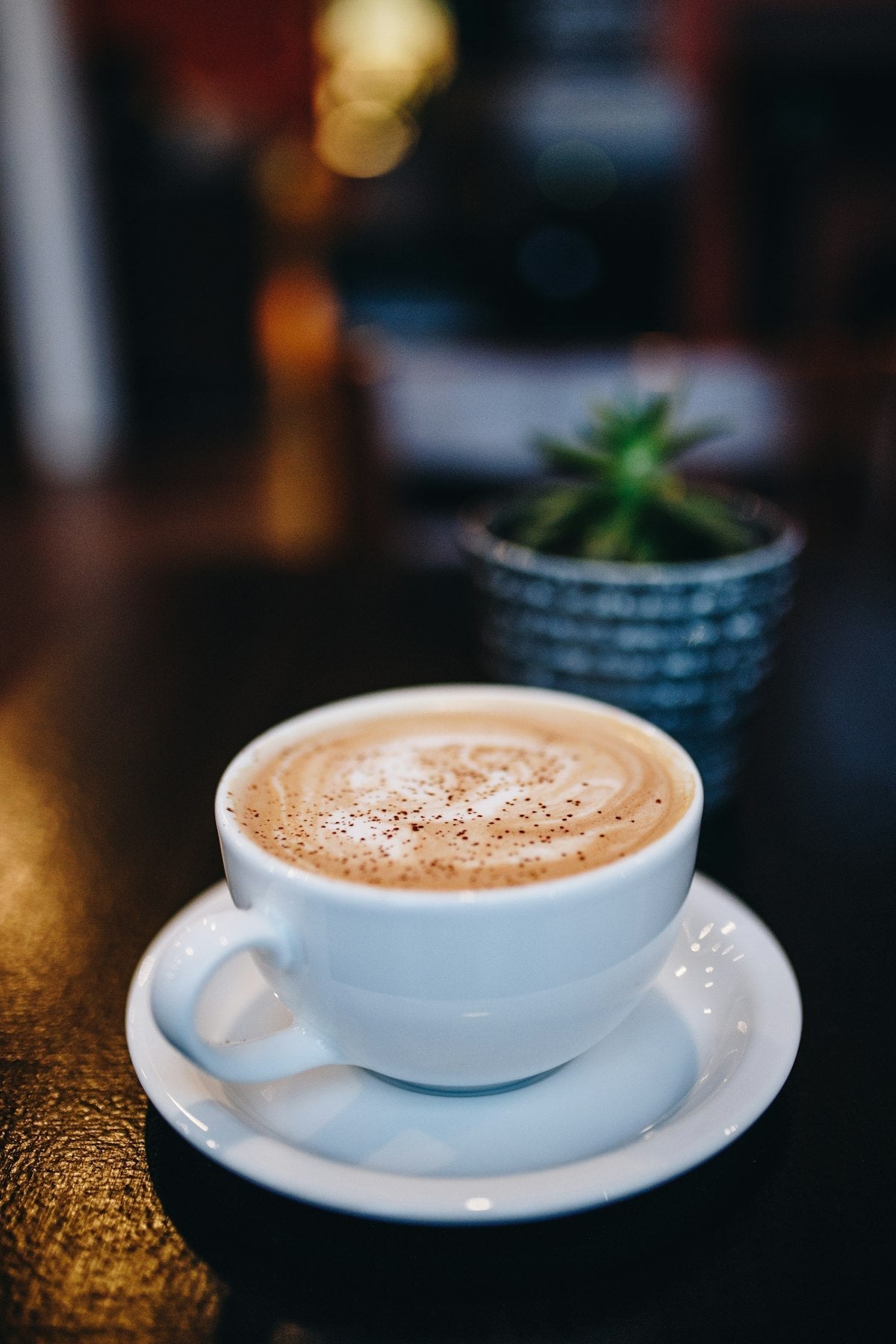 Specialty coffee being poured into a mug, illustrating body, acidity, and finish evaluation