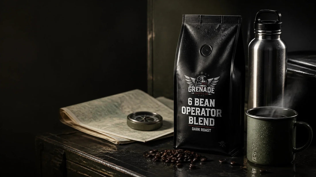 Grenade Coffee 6 Bean Operator Blend beside a stainless steel water bottle and enamel mug on a rugged field workbench