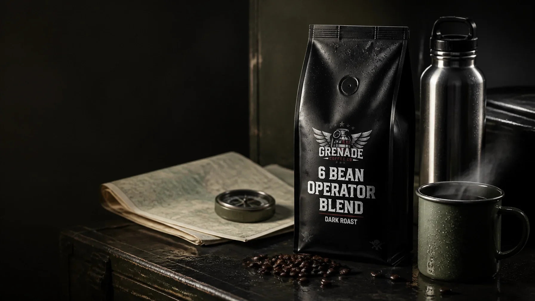 Grenade Coffee 6 Bean Operator Blend beside a stainless steel water bottle and enamel mug on a rugged field workbench