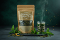 Grenade Coffee Moroccan Mint Tea premium loose leaf kraft pouch with fresh mint sprigs and Moroccan glass on dark stone