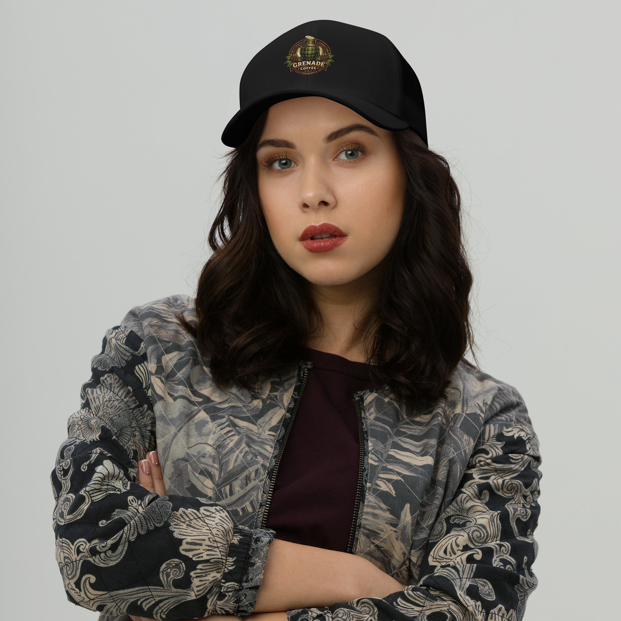 Six-panel mid-profile trucker cap with mesh back and adjustable closure
