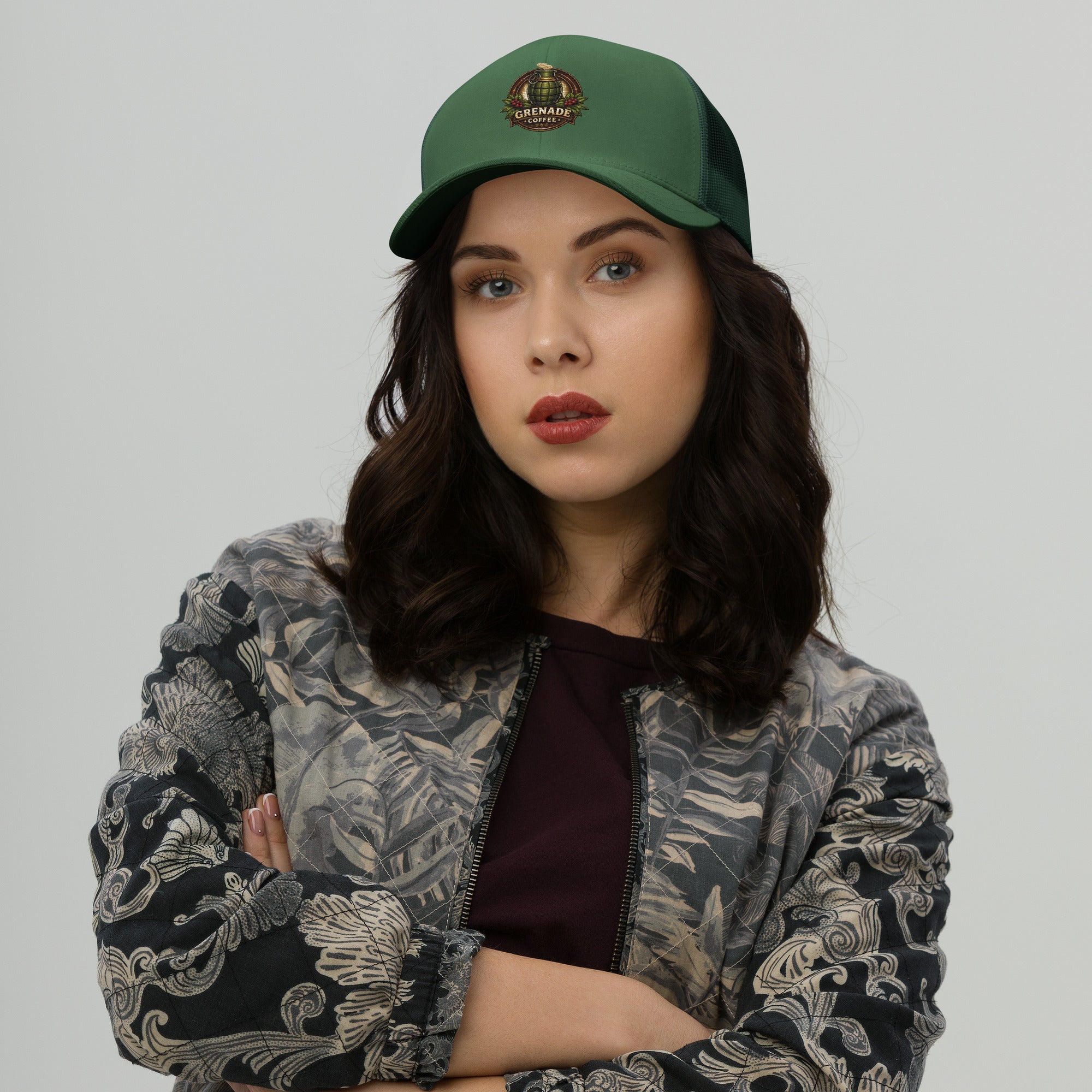 Six-panel trucker cap with mesh back, adjustable closure, and permacurv visor